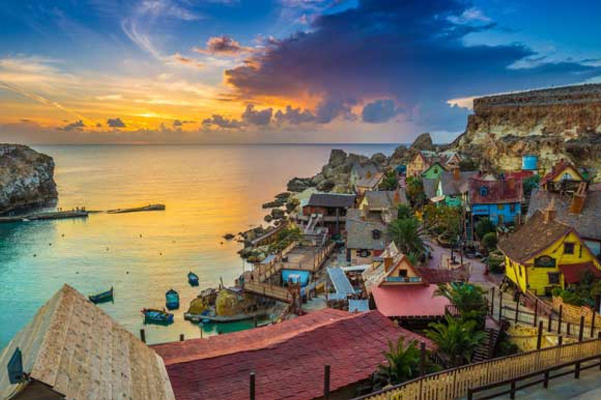 Popeye Village at sunset set in Mellieha overlooking the sea