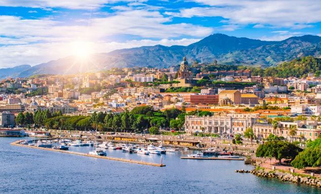 Sunrise over the harbour in Messina, Sicily