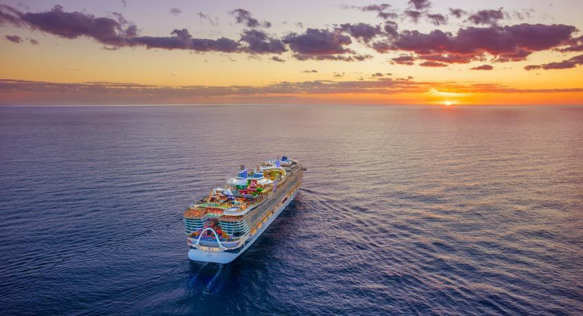 Icon of the Seas sailing into the sunset