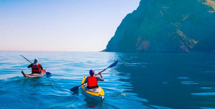 Two people kayaking in the sea
