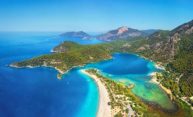 Golden sands & turquoise waters of a beach in Olu Deniz, Dalaman