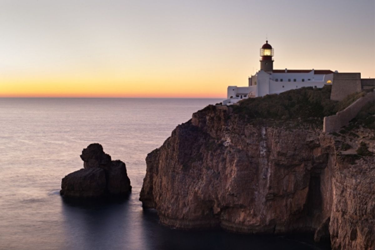 A beautiful sunset over the The famous lighthouse of Cabo Sao Vicente in Sagres, Portugal