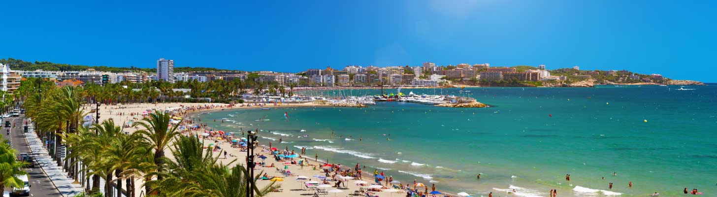 Holiday makers on the golden sands of a beach in Salou