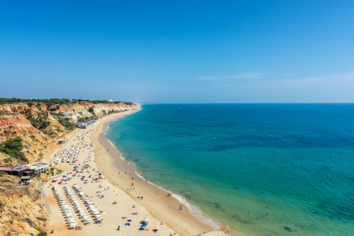 The picturesque Praia da Falésia sands in Portugal's Algarve region lined with sunloungers