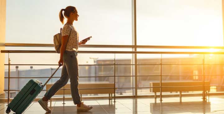 Woman with suitcase in airport