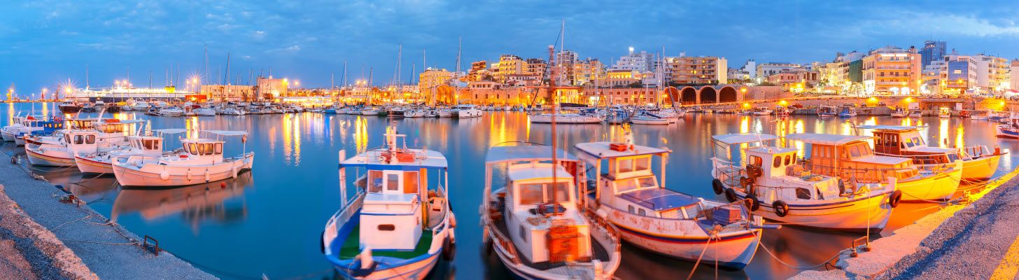 Fishing boats & marina at dusk in Heraklion, Crete