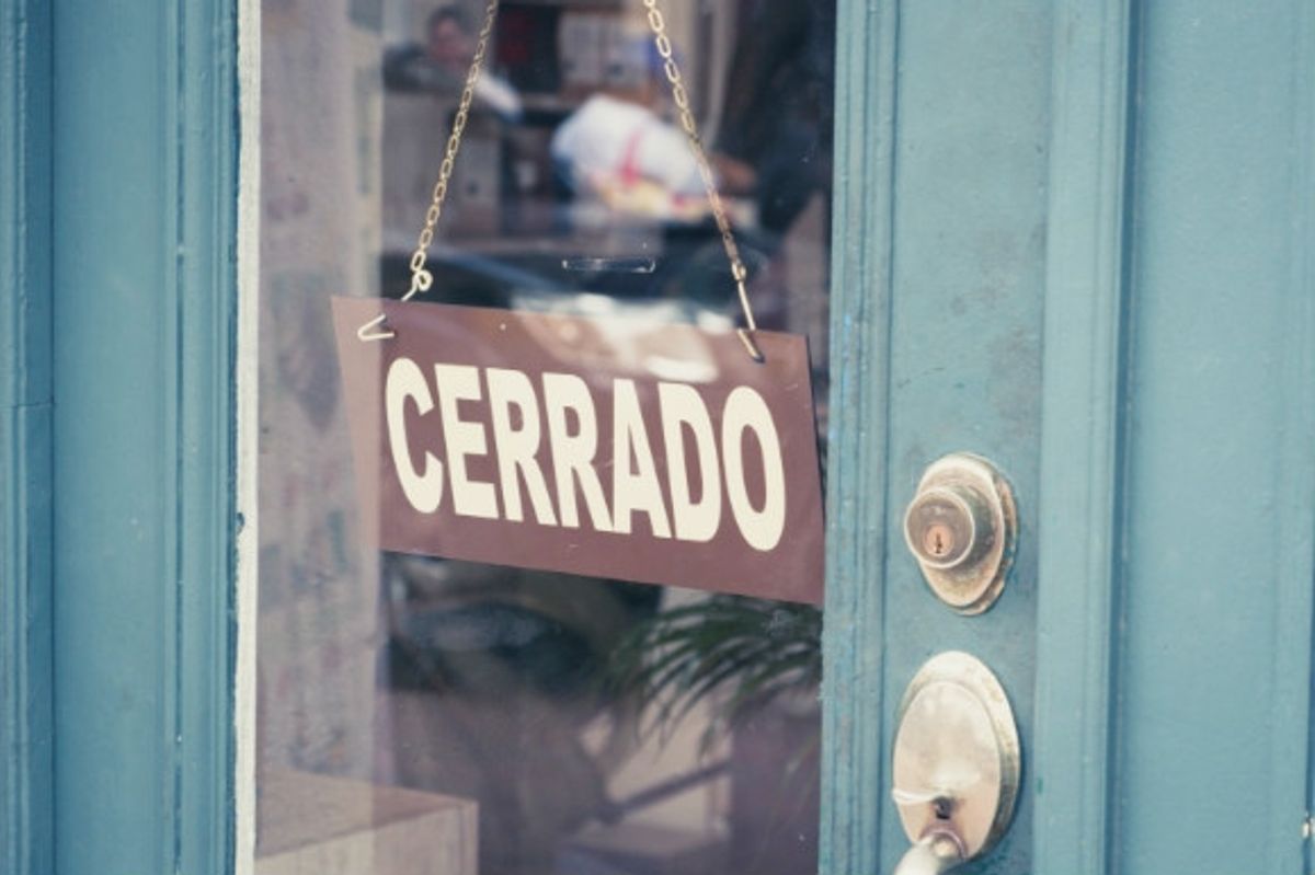 Traditional Siesta time in Spain when the shops are shut. Cerrado is the Spanish word for closed in a shop window.