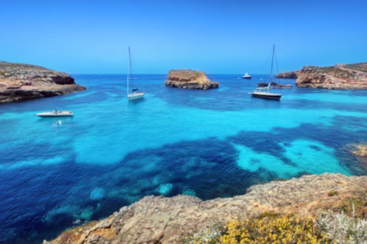 The Blue Lagoon and its yacht-filled waters and azure waters on the island of Comino Malta