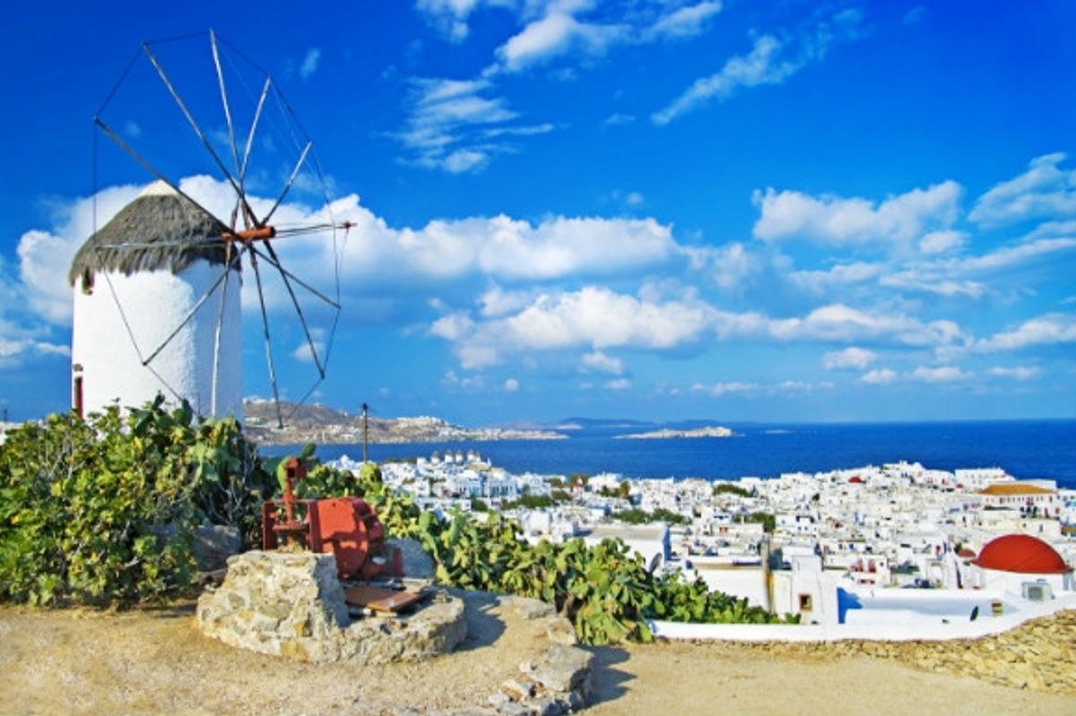 Whitewashed houses and towering windmills of Mykonos in Greece.