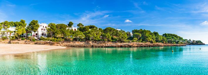 Golden sands & turquoise waters of a beach in Majorca