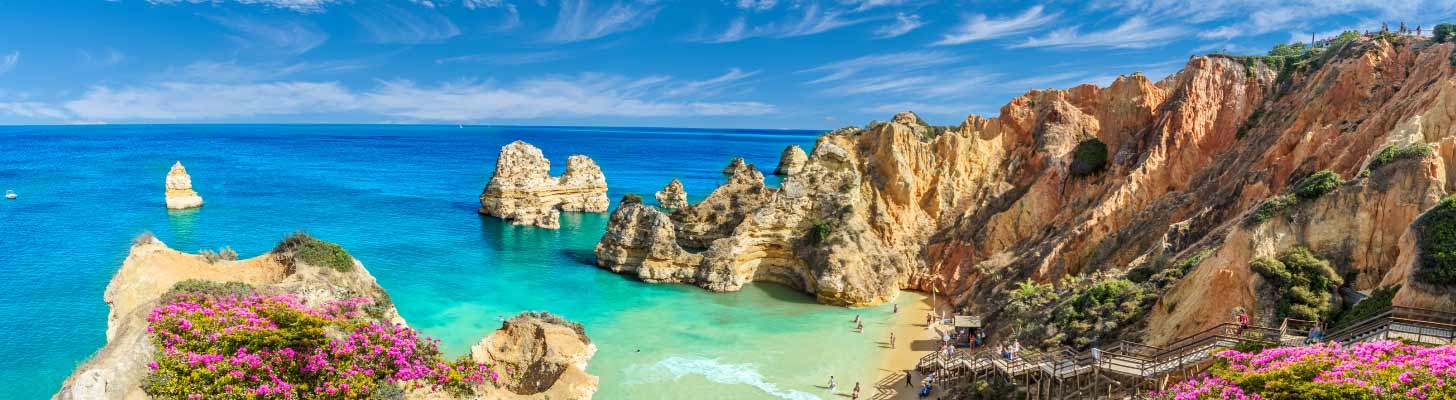 Sandy beach with turquoise water in the Algarve, Portugal