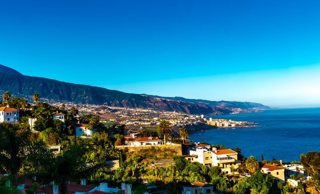 Houses line the coast in Tenerife