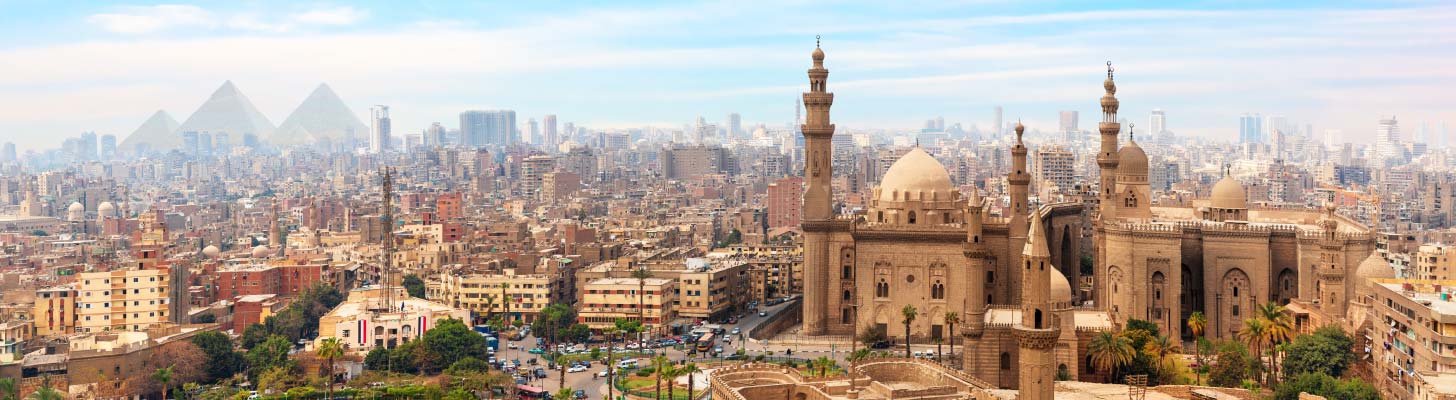 Skyline of Cairo with the pyramids in the background