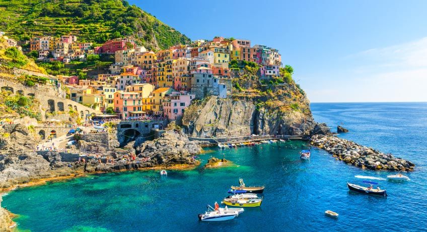 Colourful houses line the shore in the Cinque Terre Italy