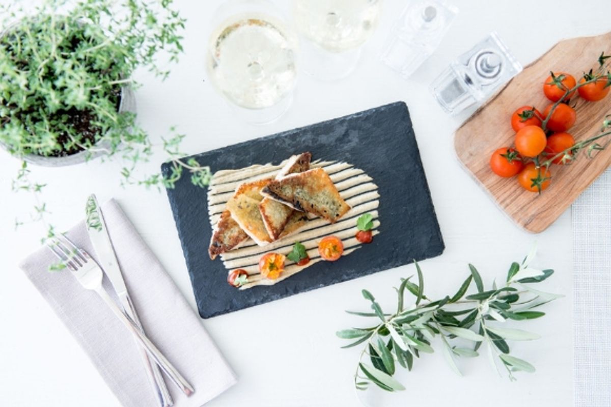 The dining scene at the new Ikos Andalusia in the Ouzo Greek Restaurant