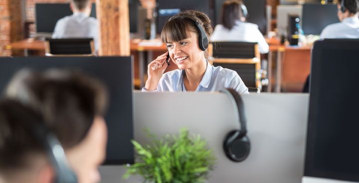 Woman on telephone in call centre