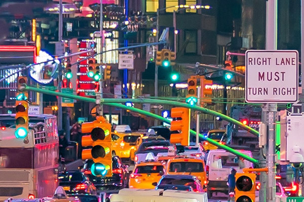 Vibrant Times Square in New York city and its neon lights and traffic-filled roads