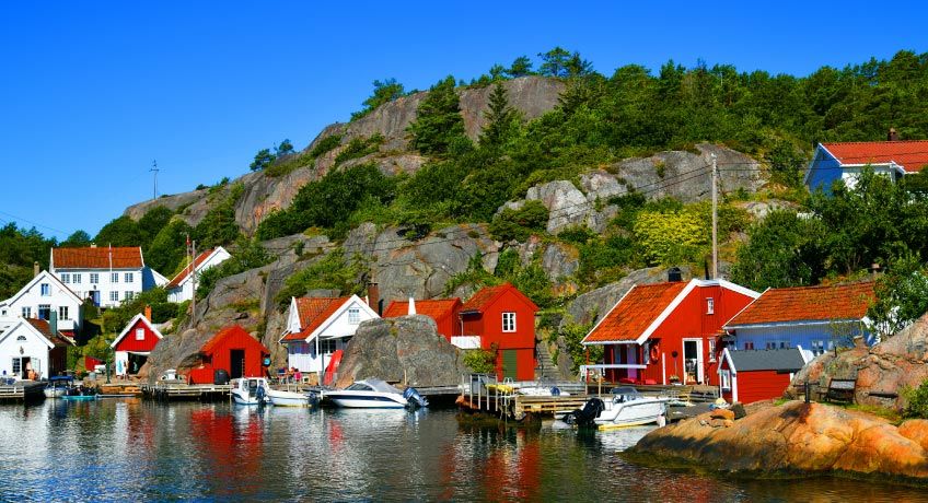 Colourful houses along the shore in Kristiansand, Norway
