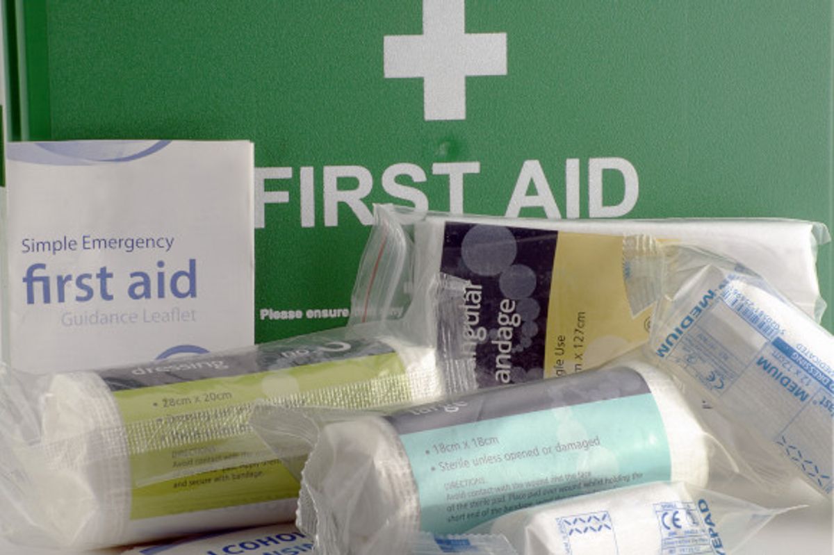 First aid kit filled with bandages and leaflets