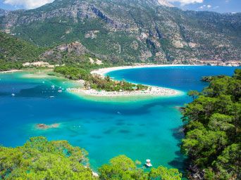 Golden sands & turquoise waters of a beach in Olu Deniz