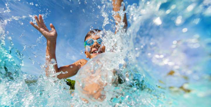 Child splashing in the sea