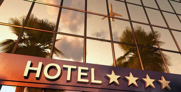 Reflection of airplane on windows of airport hotel