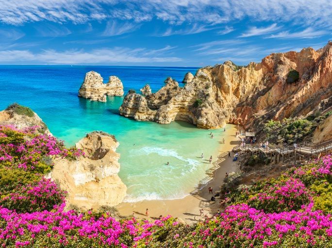 Cliffs & golden sands on a beach in Portugal