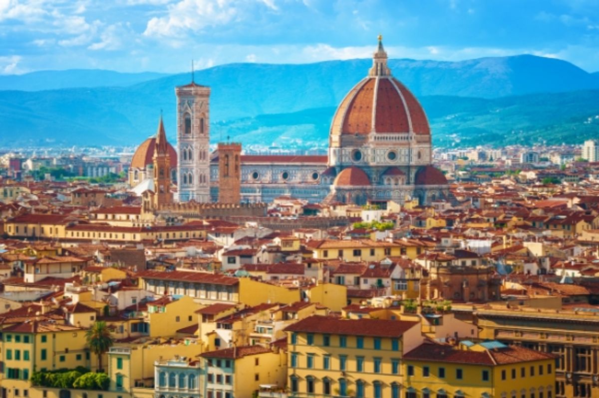 An elevated view of Florence in Italy with mountains in the background 