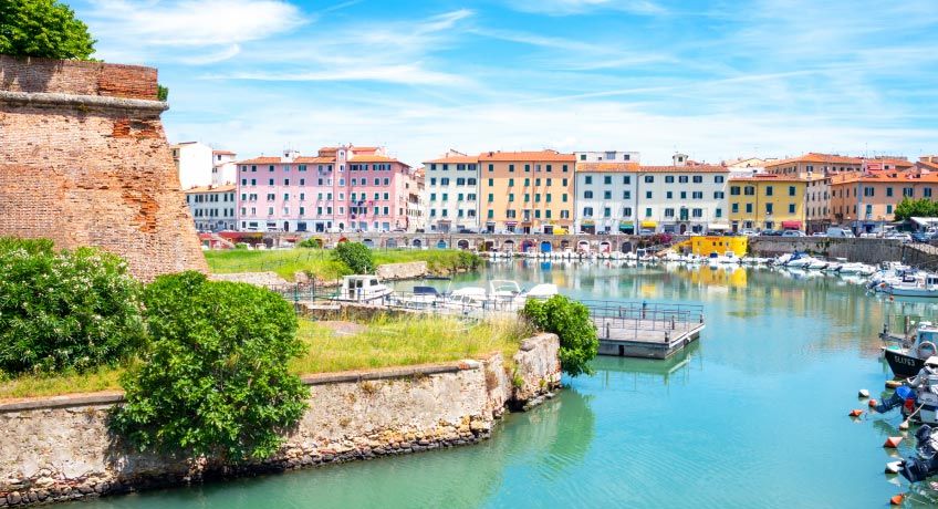 Colourful houses line the water in Livorno