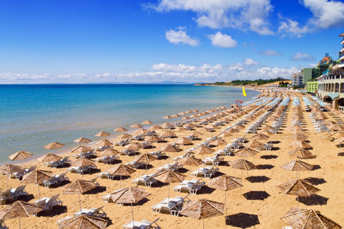 A golden beach scattered with sunloungers in Nessebar, Bulgaria