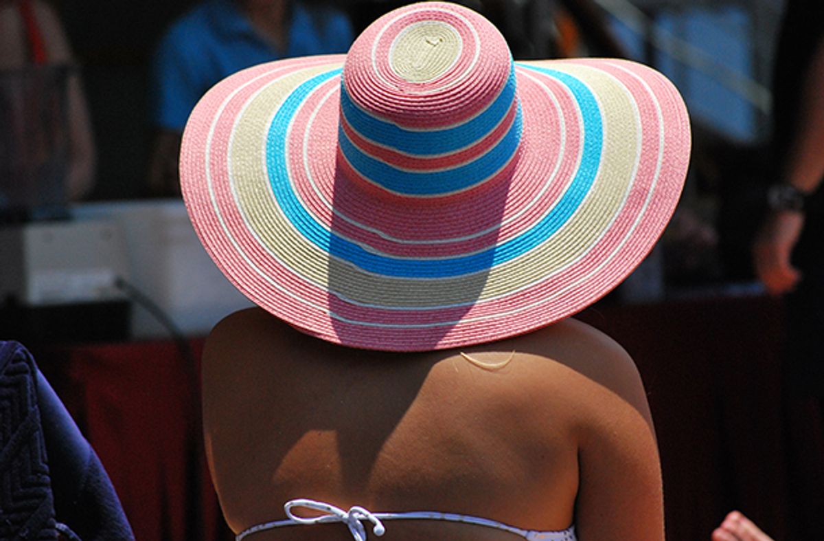 Woman wearing a sun hat on a cruise holiday