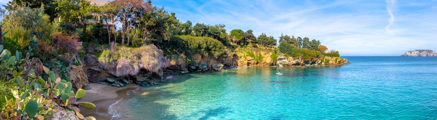 Sandy cove with crystal clear water in Agia Pelagia in Crete