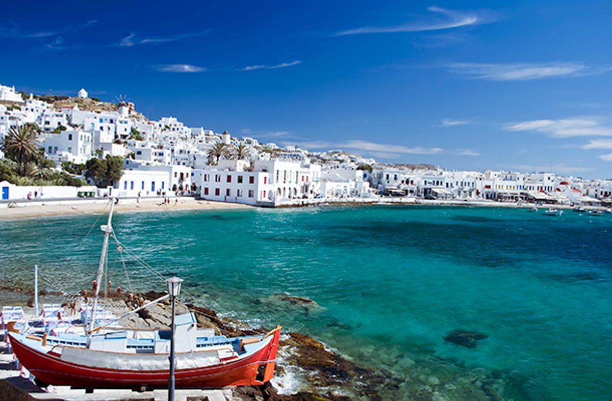 Bay in Mykonos Greece with boat in foreground