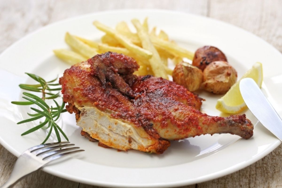 Portugal's famous spicy piri piri chicken dish served with chips