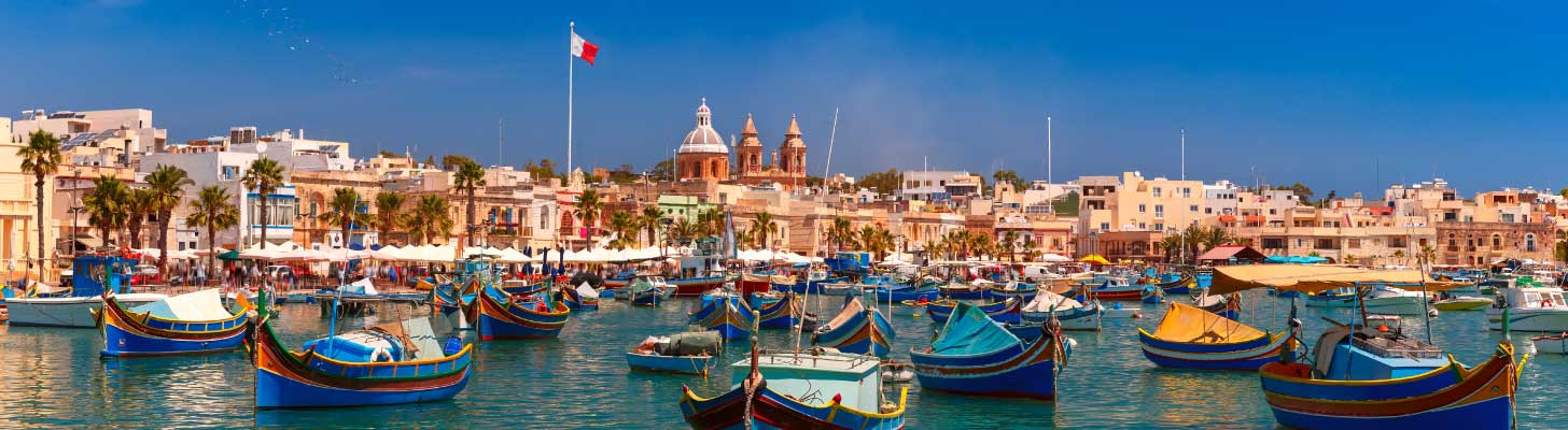 Colourful boats in the harbour at Marsaxlokk, Malta