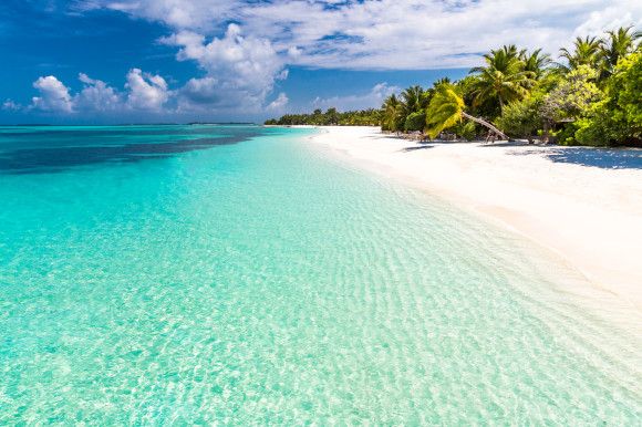 A tropical beach with white sands & turquoise sea 