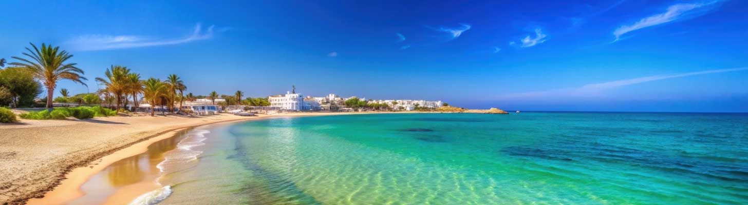 Clear blue waters & golden sand in Hammamet, Tunisia