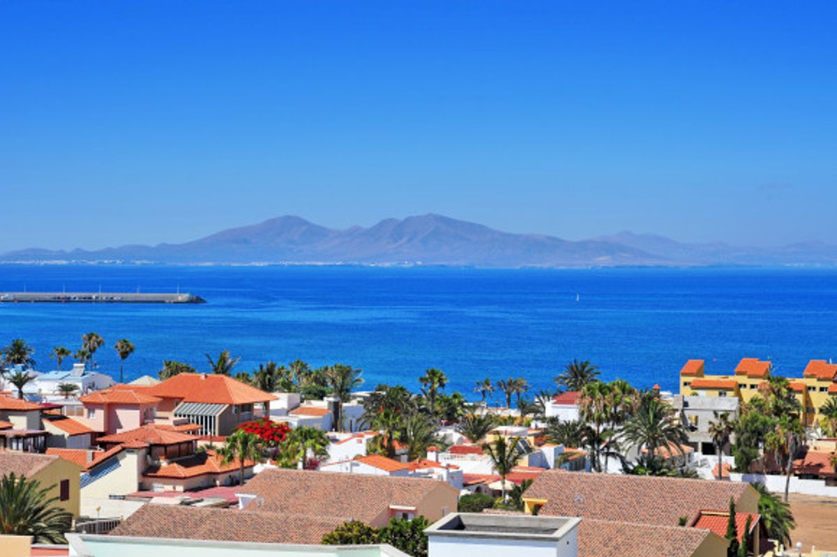 Sunny day in Corralejo Fueteventura with dramatic views of the Lobos Island in the distance