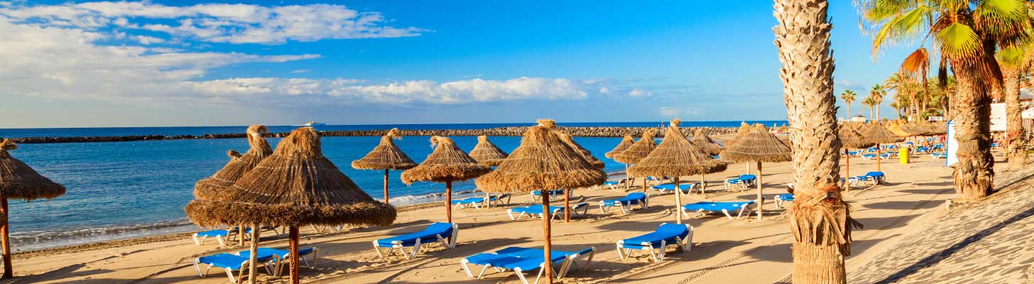 Sunbeds & umbrellas on the golden sands of Los Cristianos beach