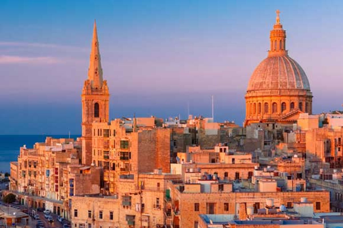 An aerial shot of Malta's capital, Valletta, at sunset 