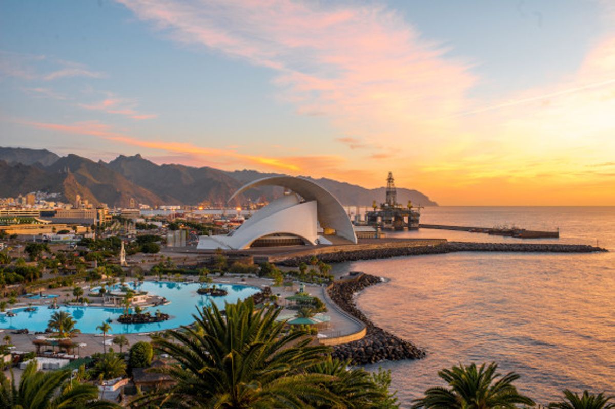 Santa Cruz in Tenerife at sunset with a backdrop of mountains and sea 