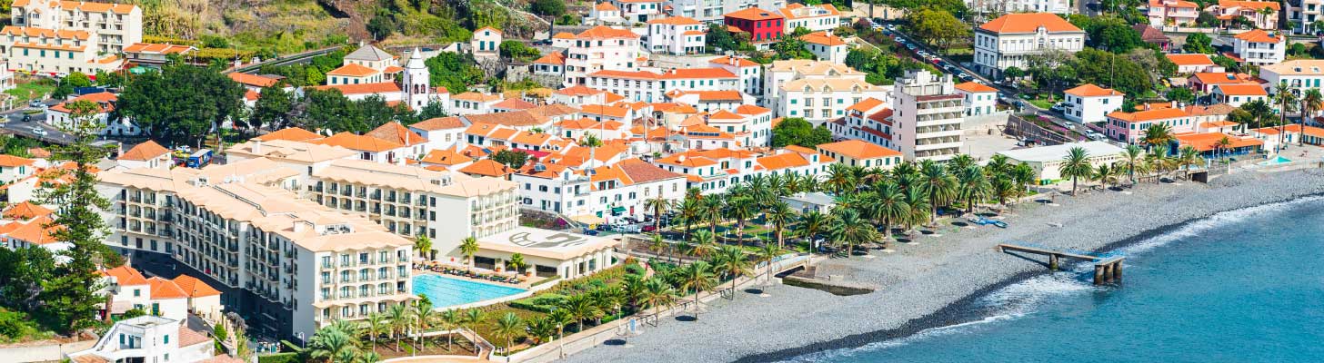 Houses & hotels at the waters edge in Santa Cruz, Madeira