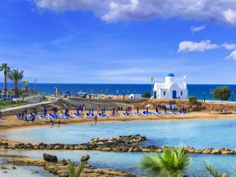 White church overlooking a beach in Cyprus