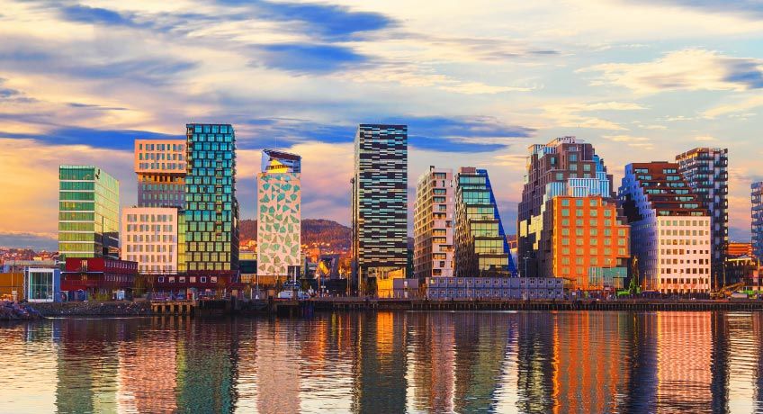 Modern buildings line the shore in Oslo, Norway