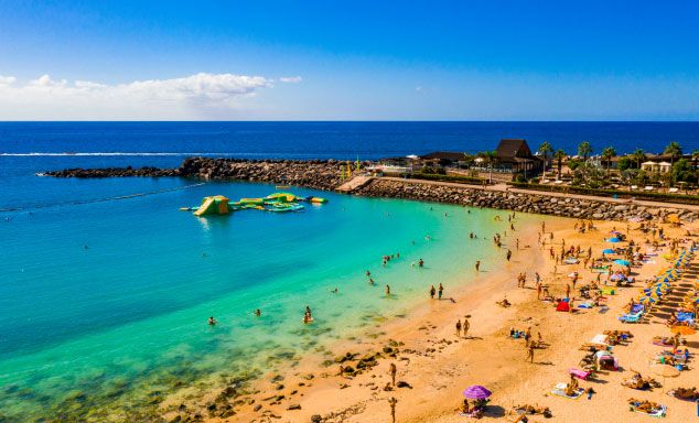Holiday makers on the beach in Gran Canaria
