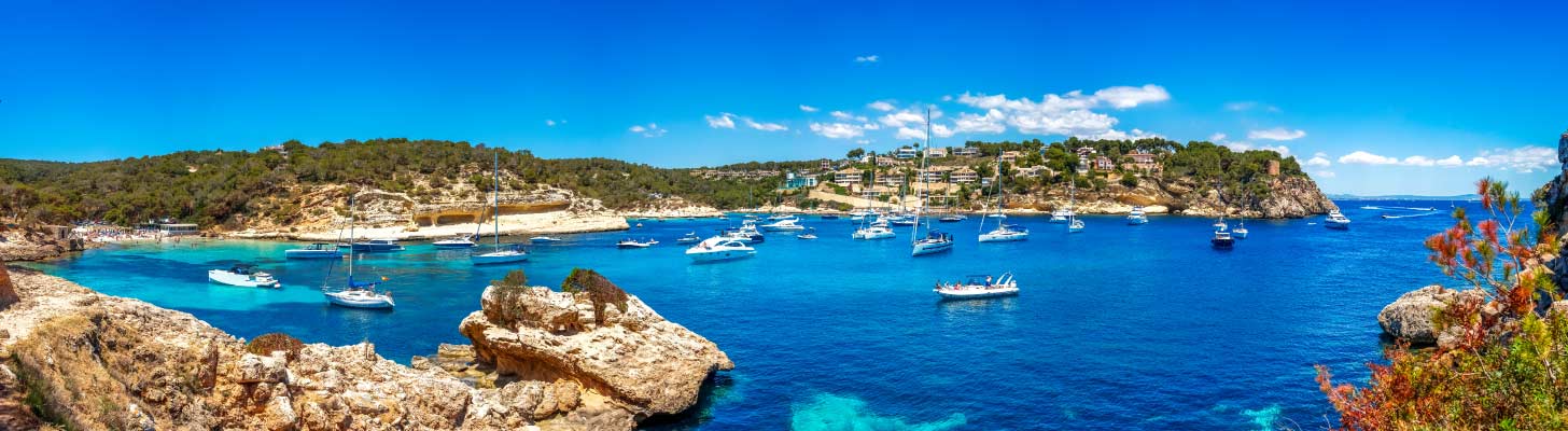 Yachts in the blue sea at Playa del Mago in Majorca