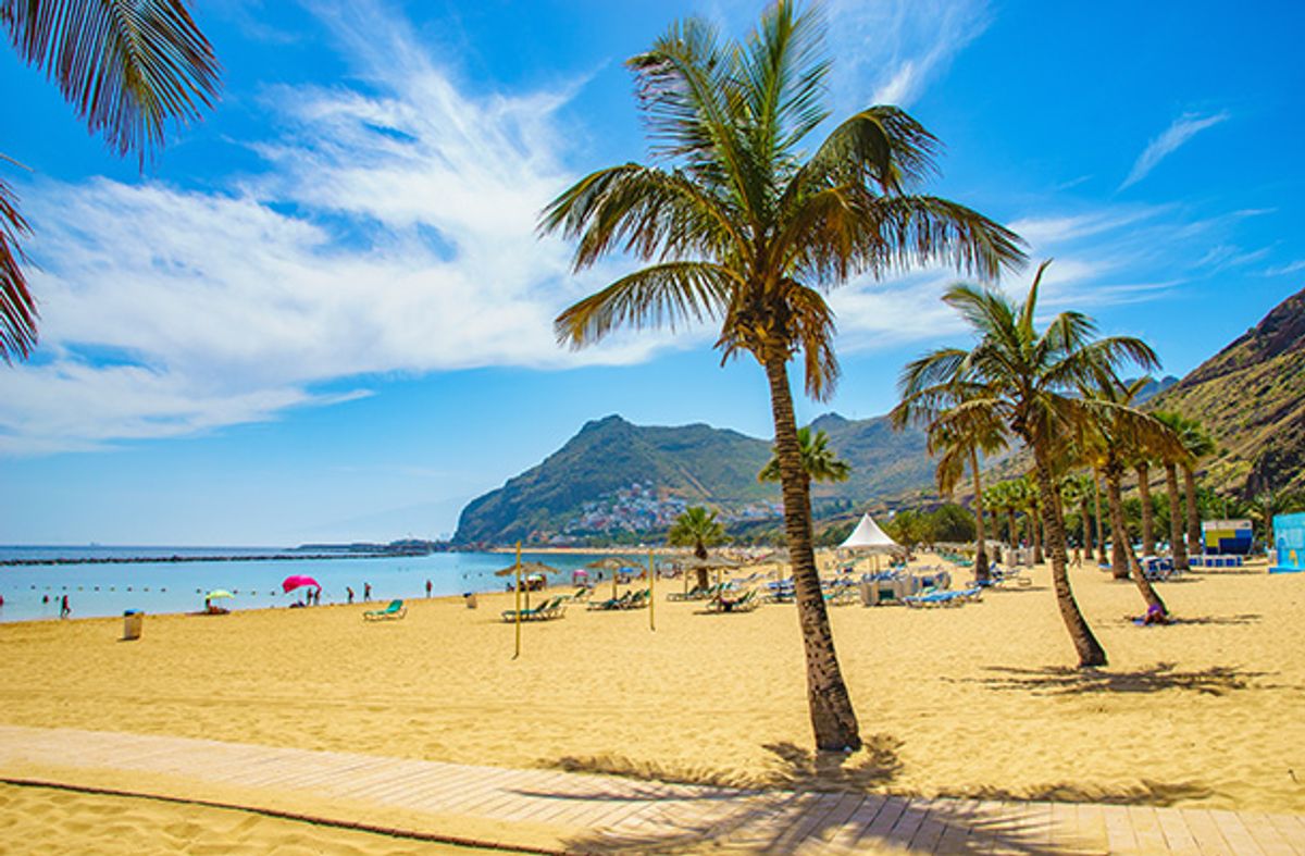 Golden sand beach on Tenerife with Mount Teide in background