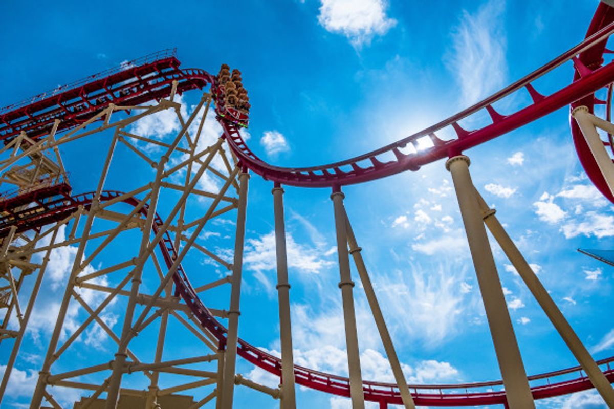 Low angle view of a huge rollercoaster in a Florida theme park with a blue sky in the background