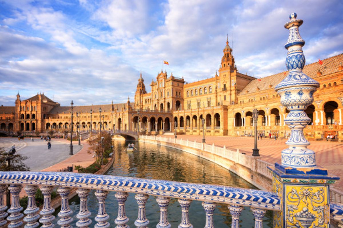 Plaza de Espana in Seville surrounded by glistening water and ornate bridges