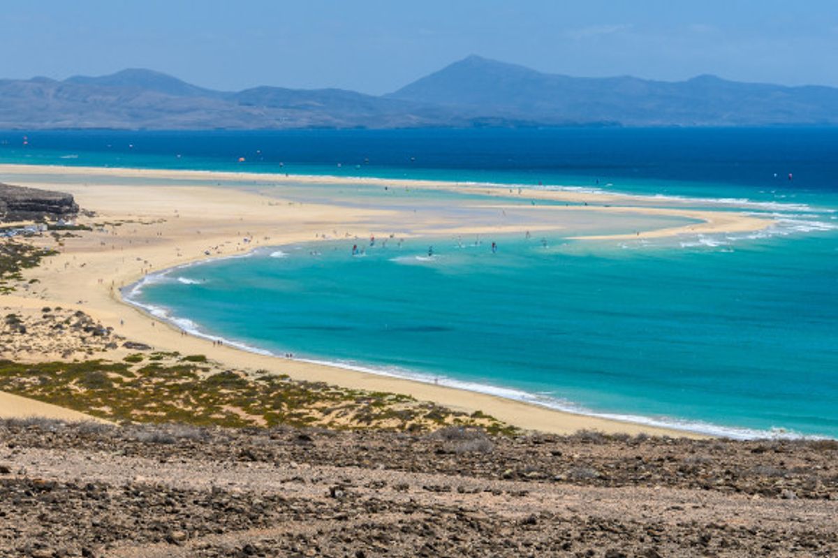 Sotavento Beach in Fuerteventura with golden sweeping sands and azure waters